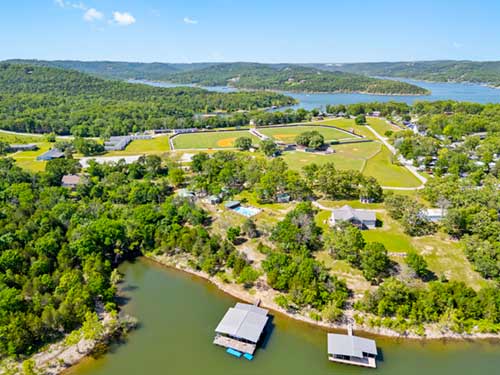 Aerial view of Twin Oaks Resort shoreline with two dock slips on the water