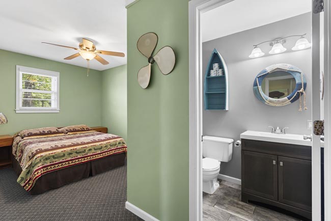 Bedroom doorway view with an adjoining bathroom in the Lake House
